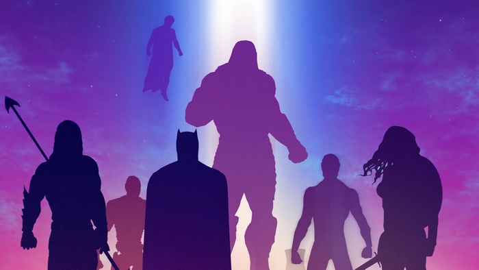 Justice League silhouettes against a colorful sky