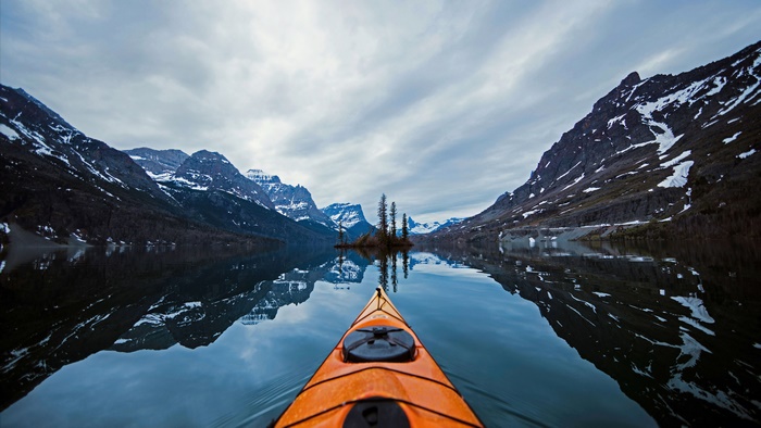 Kayak POV on a lake in Glacier National Park, Montana 4K