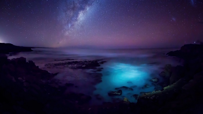 Milky Way over Bioluminescent Ocean at Night 4K