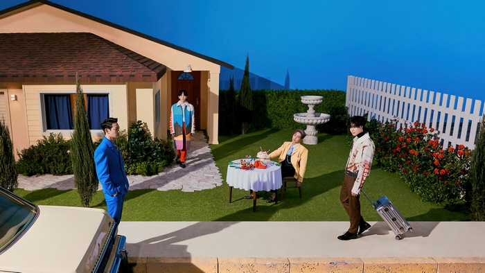 SHINee members on a surreal suburban set
