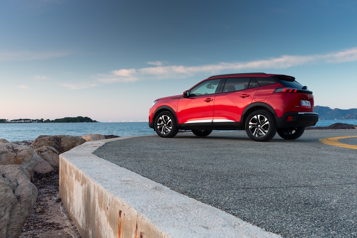 Red Peugeot 2008 SUV by the Sea