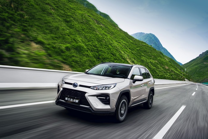 Grey Toyota Wildlander Hybrid SUV on a Mountain Road