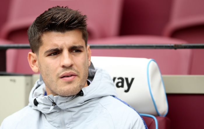 Álvaro Morata sitting on a bench