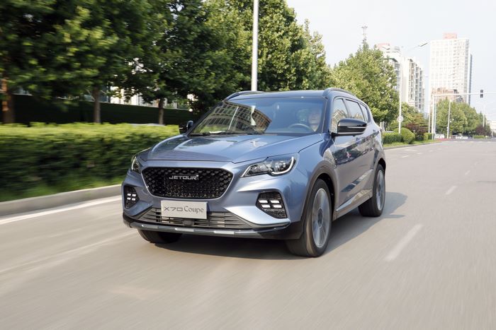 Blue Jetour X70 Coupe driving on road