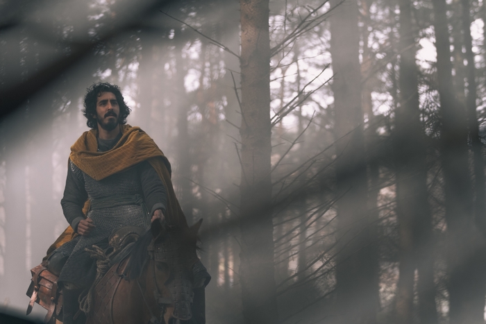 Dev Patel as The Green Knight in the forest