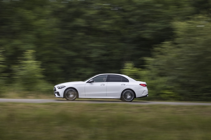 White Mercedes-Benz C 220 d AMG Line driving