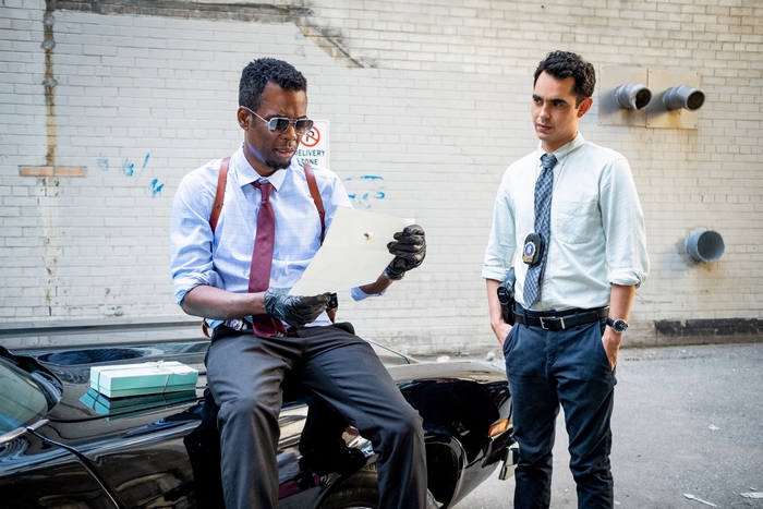 Spiral Zeke Banks and William Schenk examine evidence