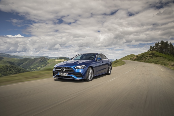 Blue Mercedes-Benz C 200 AMG Line on a Mountain Road