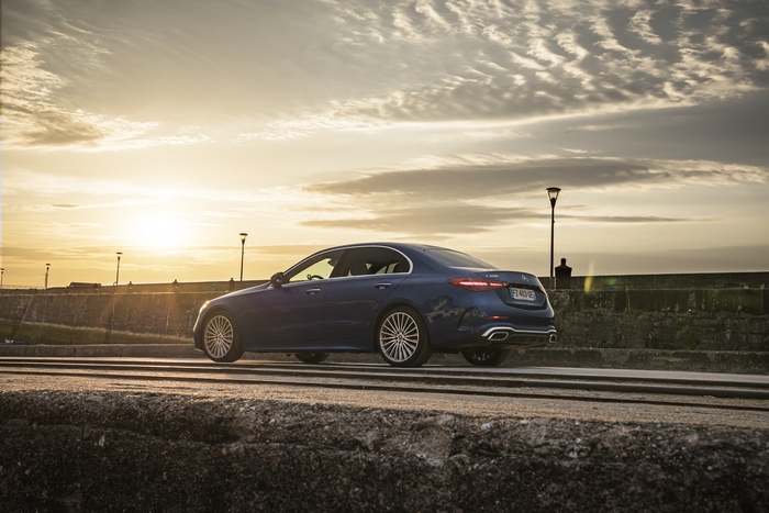 Blue Mercedes-Benz C 200 AMG Line Sedan at Sunset
