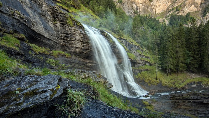 4K Waterfall in a Rocky Forest Landscape