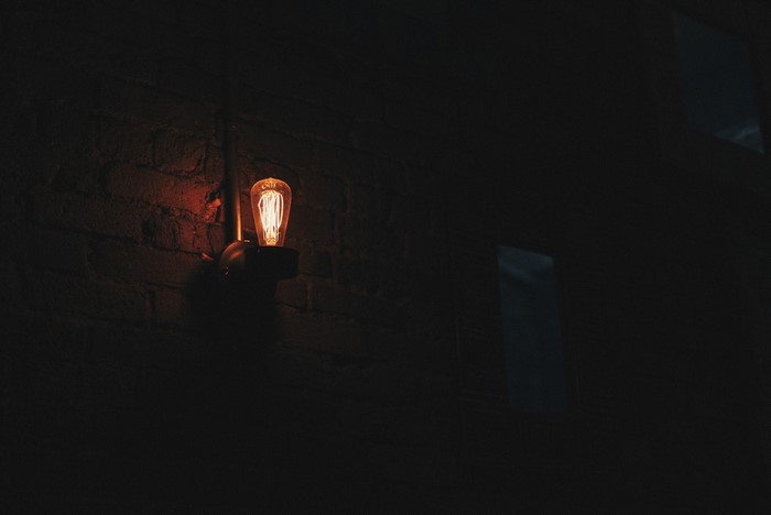 Edison light bulb on a brick wall