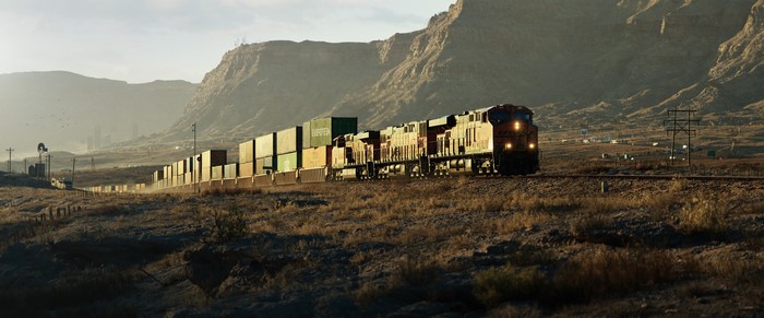 Freight train in a desert landscape