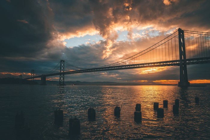 Bay Bridge at Sunset Over Water