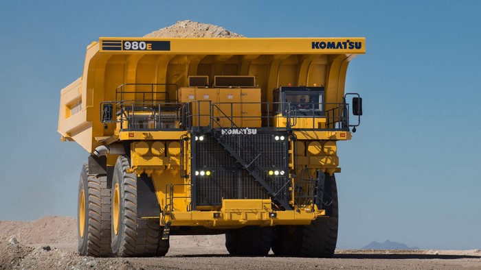 Komatsu 980E mining dump truck loaded with dirt