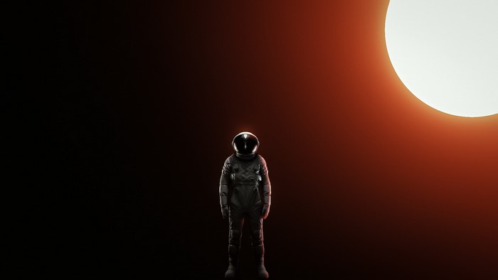 Astronaut standing in front of the Sun