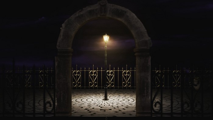 Lamp post at the End of Time with a fence