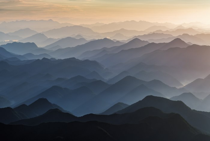 Layered mountains in the morning mist