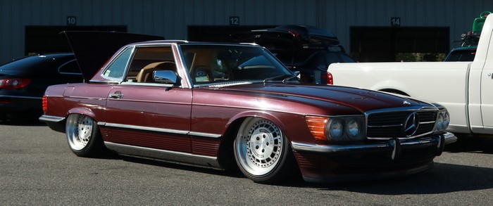 Maroon Mercedes-Benz SL with custom wheels