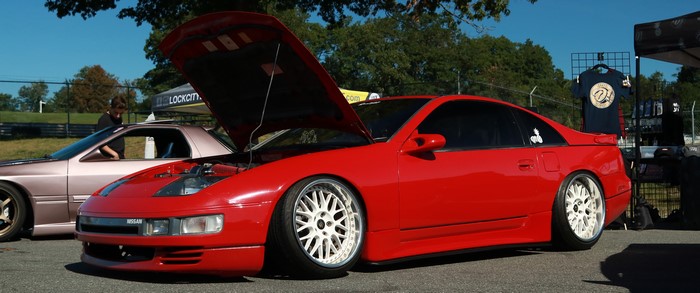 Red Nissan 300ZX with hood open at car show
