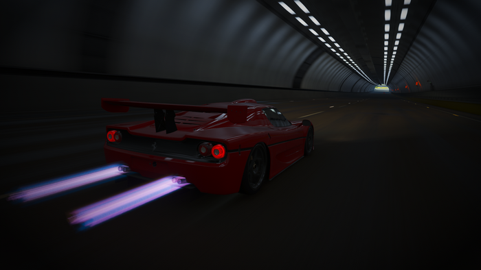 Red Ferrari F50 GT racing through a tunnel