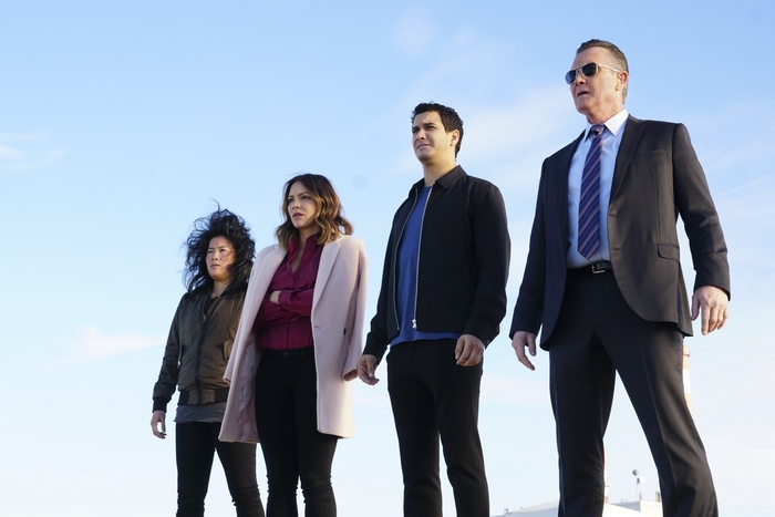Scorpion cast standing outdoors