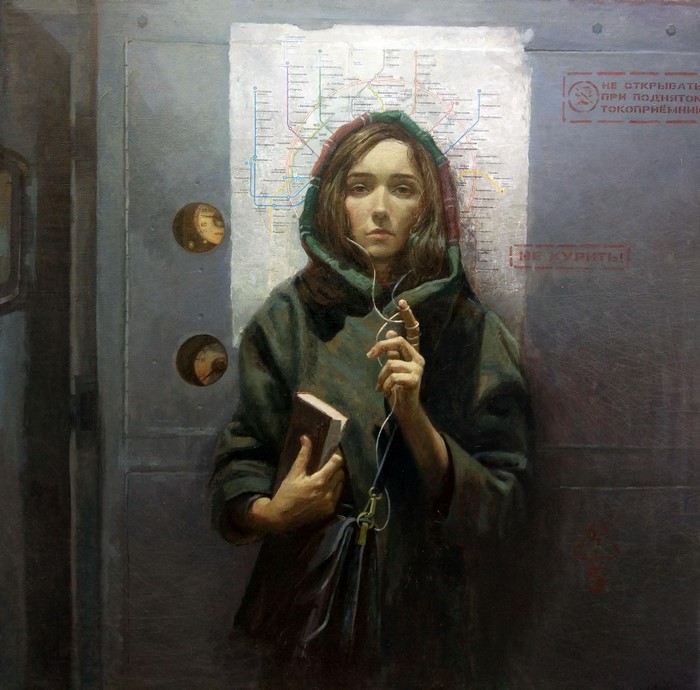 Woman in metro with headphones and book