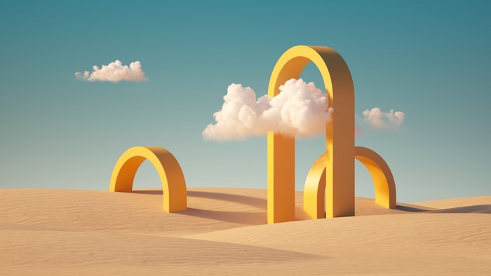 Yellow arches in a desert landscape with clouds