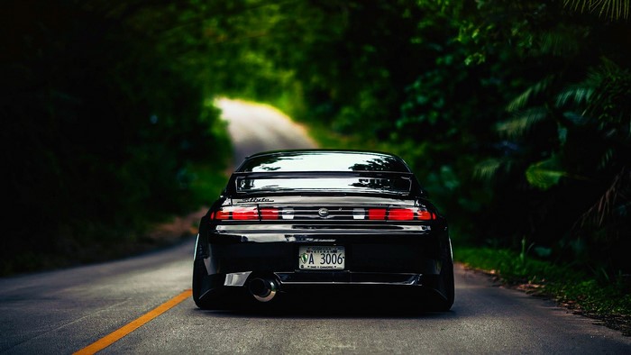 Black Nissan Silvia S14 on a Forest Road