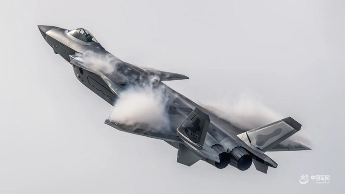 J-20 fighter jet in flight with vapor trails