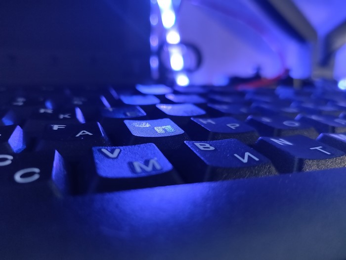 4K macro photography of a backlit keyboard
