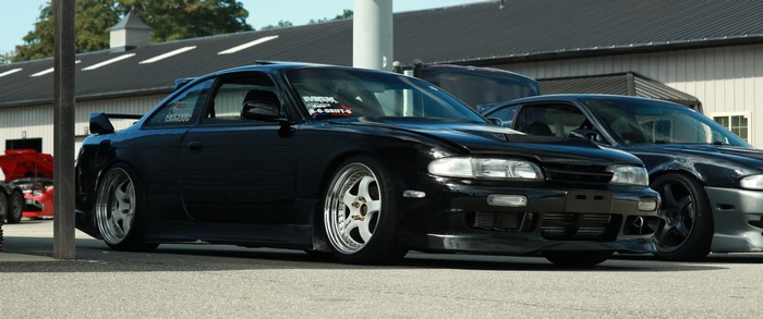 Black Nissan Silvia S14 cars parked outdoors