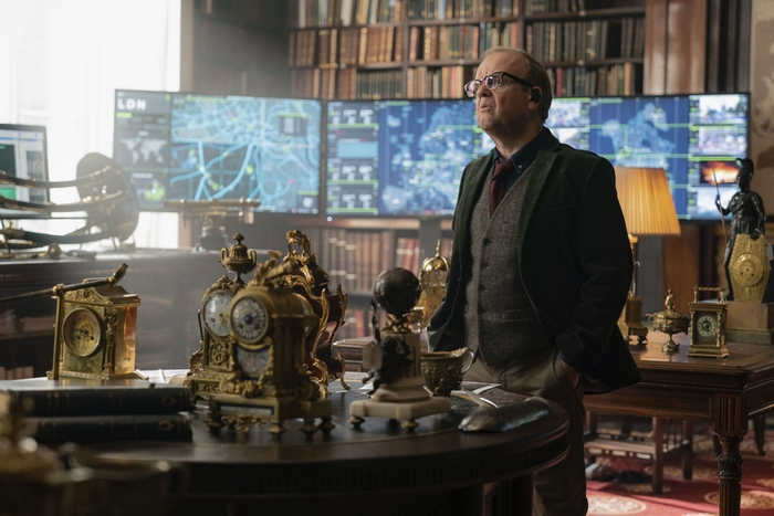 Toby Jones in a study with monitors