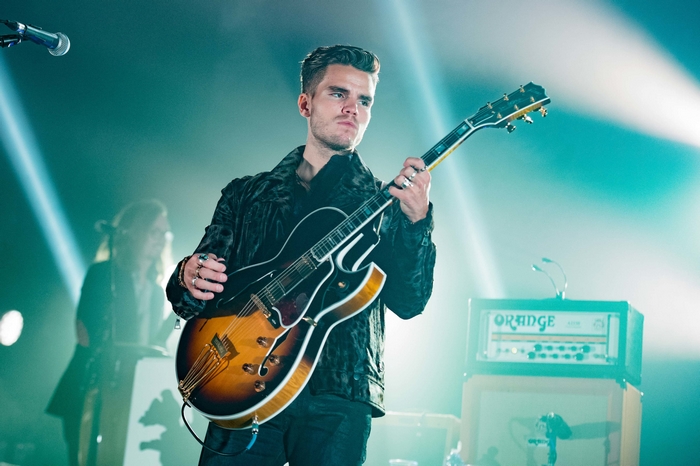 Jökull Júlíusson of KALEO playing guitar on stage
