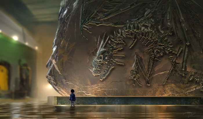 Child looking at a dragon fossil in a museum