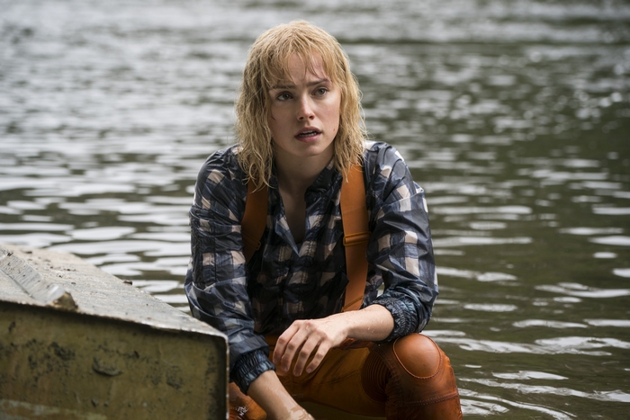 Daisy Ridley in a plaid shirt and suspenders