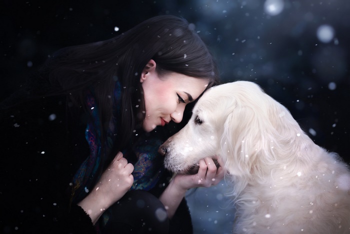 Woman and Golden Retriever in Snow