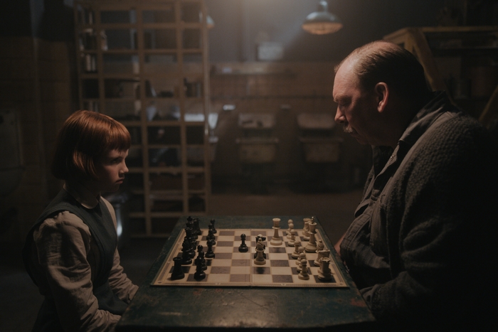 Beth Harmon and Mr. Shaibel play chess