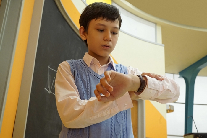 The Mysterious Benedict Society boy checks watch