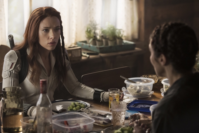 Scarlett Johansson as Black Widow at a table