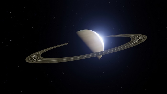 Saturn and its rings in space
