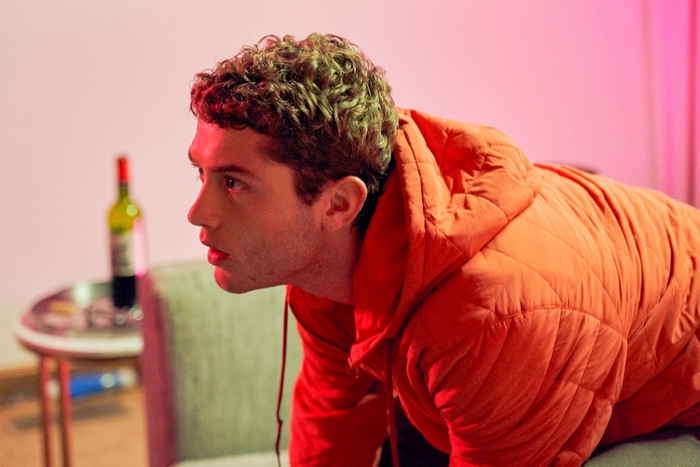 Raff Law in orange jacket