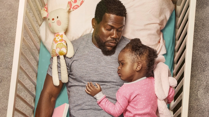 Kevin Hart and daughter sleeping in crib
