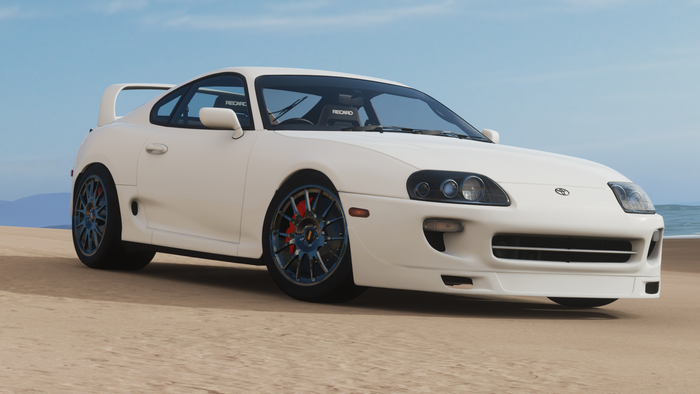 White Toyota Supra Sports Car on Beach