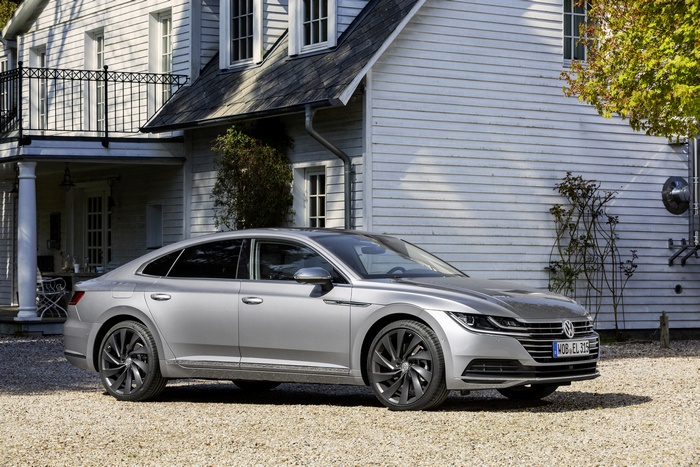 Silver Volkswagen Arteon parked in front of a house