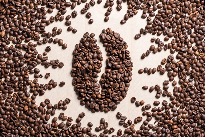 Coffee beans arranged in a coffee bean shape