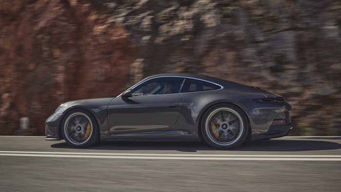 2022 Porsche 911 GT3 Touring driving on a road