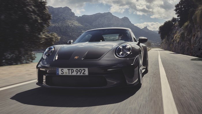 2022 Porsche 911 GT3 Touring driving on a scenic road