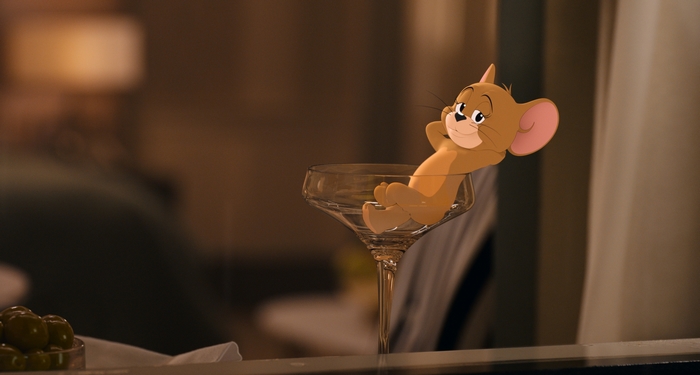 Jerry relaxing in a champagne glass