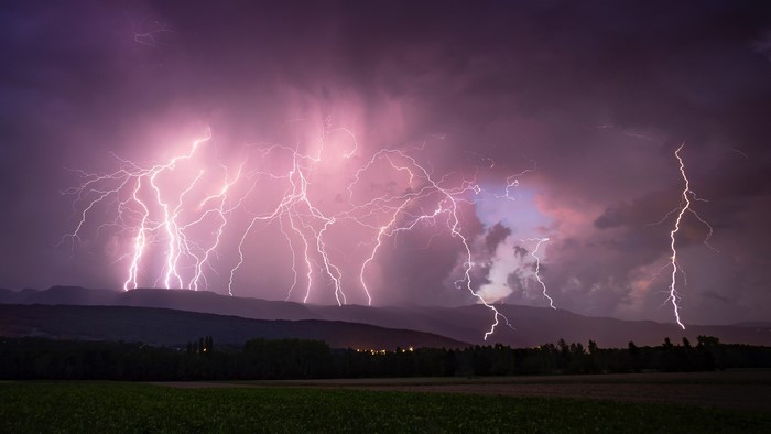Storm and Lightning Over Hills and Fields