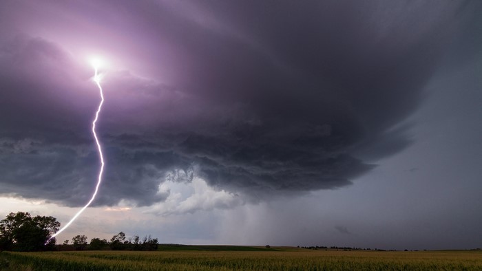 Stormy Field with Lightning and Dark Clouds